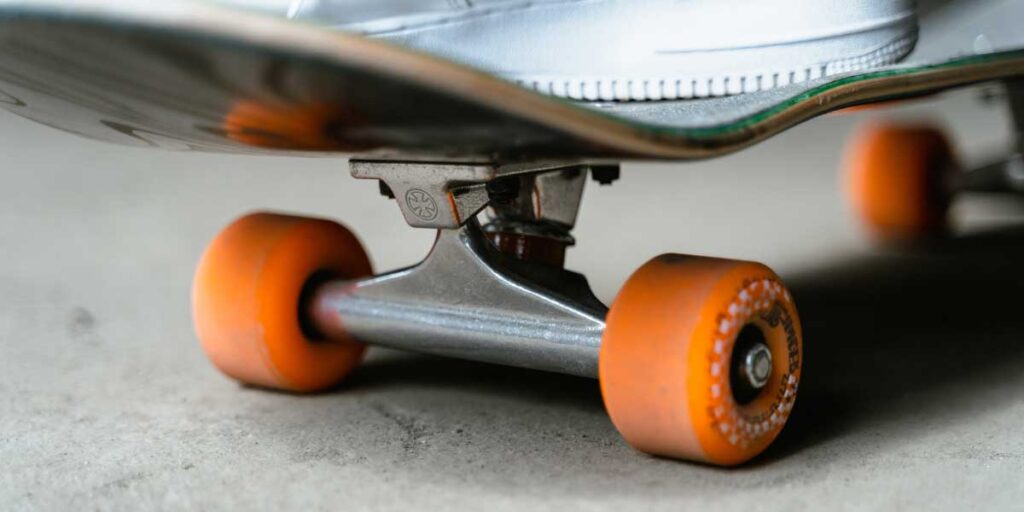 how much does a skateboard weigh? -blog post image. a micro-shot of skateboard trucks and wheel